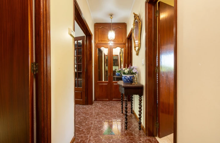 Interior hallway with antique mirror and console